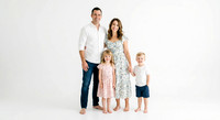 Firefly_Gemini Flash_Professional family portrait in a bright photography studio, seamless pure white back 893387